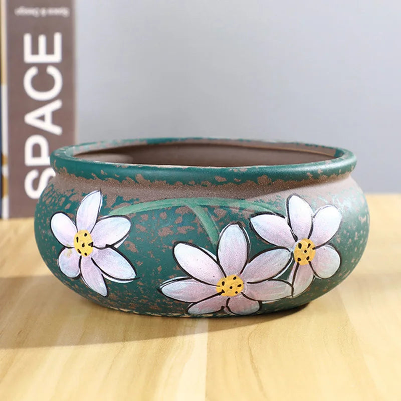 cache pot céramique artisanal fleurs colorées feuilles vertes rustique vert bleu marron beige