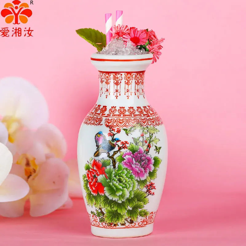 vase décoratif céramique fleurs oiseaux motifs géométriques blanc rouge vert rose traditionnel