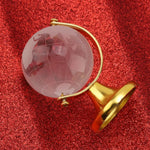 globe terrestre cristal transparent relief continents support métallique or argenté décoration élégante enseignement enfants