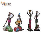 Figurine africaine en résine or style ethnique vintage
