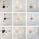lampes murales modernes abstrait cercles tiges métalliques noir doré minimaliste têtes