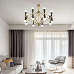 lustre suspension moderne or noir 12 sphères blanches structure métallique