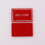tapis d'entrée marron gris rose motif géométrique adhésif classique