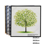 Cadre photo aluminium 20x20 cm noir sur mur blanc
