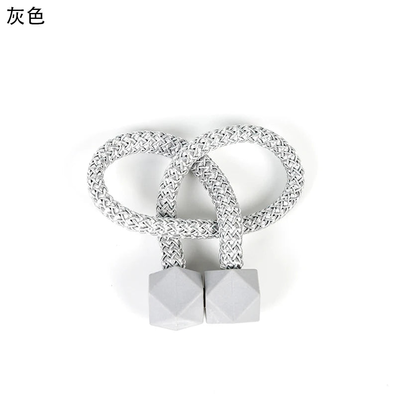 attaches rideaux décoratives modernes couleurs vives tressure cordée forme cube prismatique fixations nodales