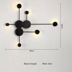 lampes murales modernes abstrait cercles tiges métalliques noir doré minimaliste têtes