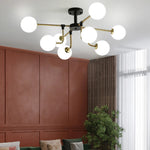 lampe suspension moderne sphères translucides structure dorée salon blanc nordique