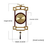 horloge murale bois chinois cadres dorés marron motif géométrique aiguilles dorées classique