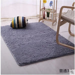 tapis moderne doux uni beige clair rose pâle bleu clair bordure fleurs noires 160cm