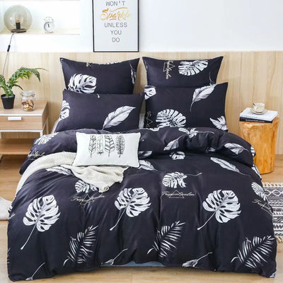 Parure de lit 140x200 en polyester sergé noir sur un lit moderne