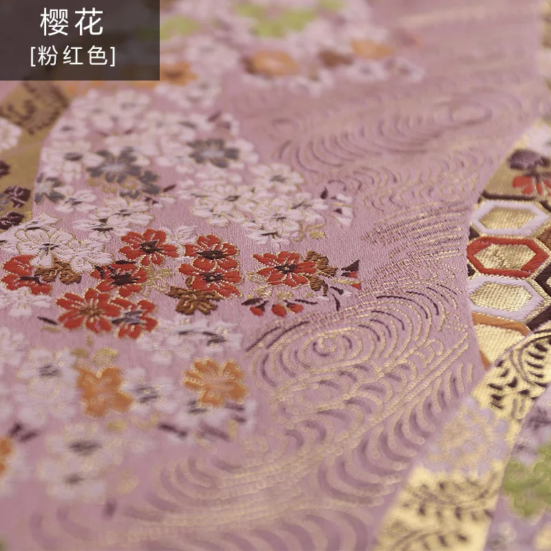 tissu traditionnel japonais brocart fleurs cerisier motifs géométriques noir rose pâle rouge vif