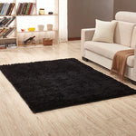 tapis moderne doux uni beige clair rose pâle bleu clair bordure fleurs noires 160cm