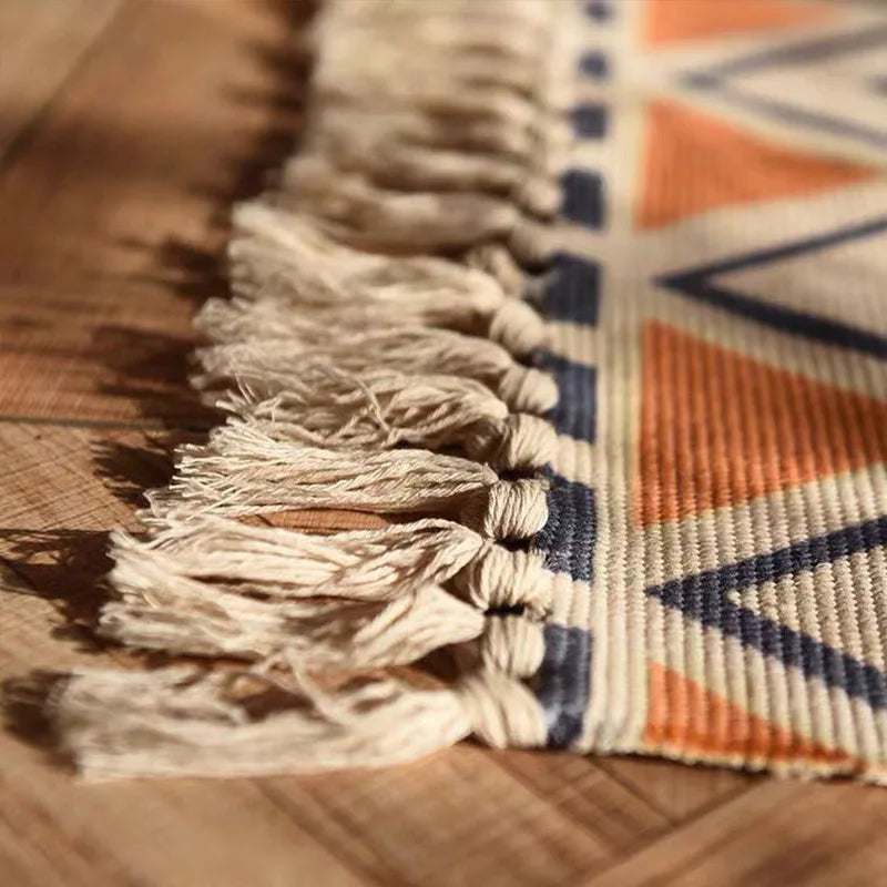 tapis boho chic motifs géométriques beige bleu orange franges extérieur plage