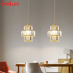 Suspension lumineuse transparente moderne rangs verre dorés élégante chambre salon