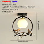 lampe moderne or noir oiseaux dorés branches sphère blanche translucide led echangement facile