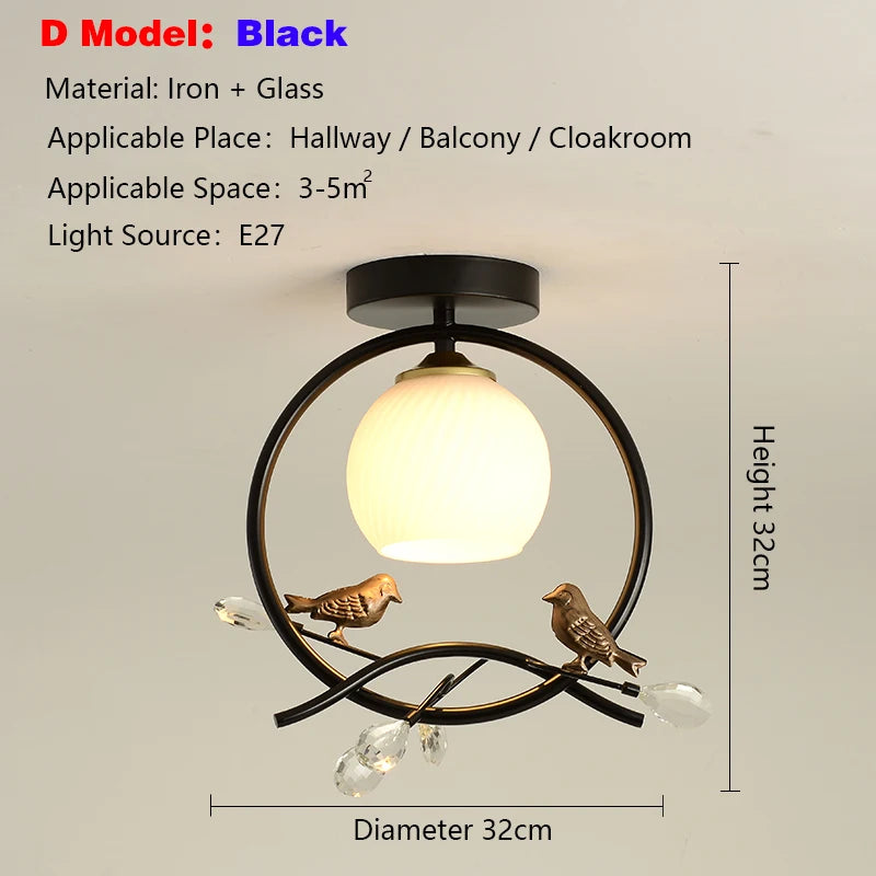 lampe moderne or noir oiseaux dorés branches sphère blanche translucide led echangement facile