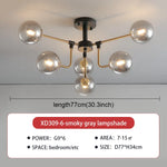 lampe suspension moderne sphères translucides structure dorée salon blanc nordique