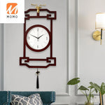 horloge murale bois chinois cadres dorés marron motif géométrique aiguilles dorées classique
