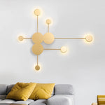 lampes murales modernes abstrait cercles tiges métalliques noir doré minimaliste têtes