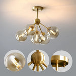 lustre moderne lumières doré sphères transparentes art déco contemporain led chambre salon