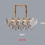 chandelier moderne luxueux transparent feuilles stylisées câbles métalliques doré argenté