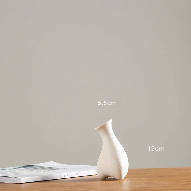 vases blancs modernes minimalistes céramique opaques fleurs artificielles table simple