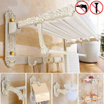 étagère salle bain blanc doré ornements sculptés finition art déco porte serviettes savon brosse