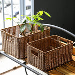 panier tressé marron clair rustique poignées intégrées pliable rangement étagères cuisine réutilisable respectueux environnement