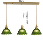suspension lumineuse vintage vert doré motifs géométriques ampoules câbles chaînes métal