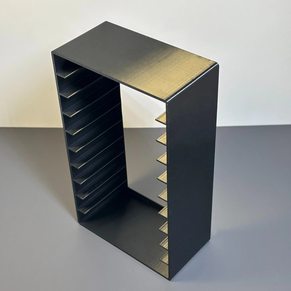 rangement cassettes audio noir texturé moderne organisation maison 11.5cm 6.1cm 19.3cm