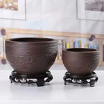 support pot noir gravé motifs classiques pots fleurs résistance corrosion