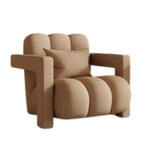 fauteuil moderne tissu texturé beige jaune marron clair coussin décoratif salon minimaliste