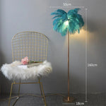 lampe sol moderne plumes blanches dorées bleu turquoise LED éclairage intérieur chambre salon élégant