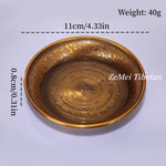 assiettes decoratives ornementales emailees motifs floraux geometriques opalescentes artisanat traditionnel bouddhiste