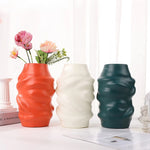 vases modernes orange blanc vert rayures horizontales opaques décoration intérieure papier bougie fleurs artificielles