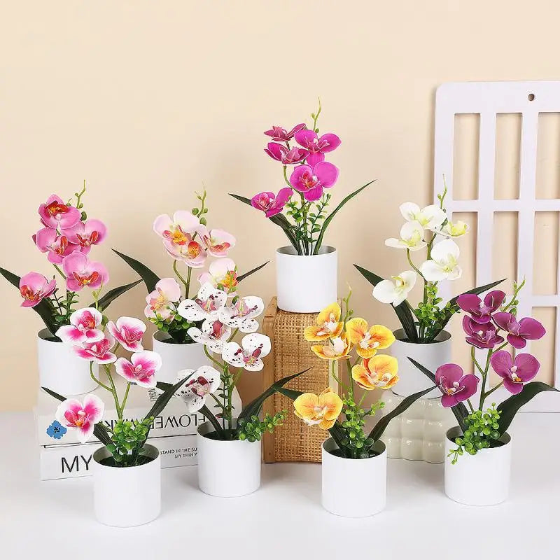 décoration intérieure orchidées artificielles pots blancs fleurs simples feuilles vertes moderne