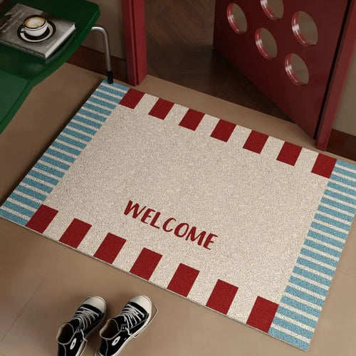 tapis d'entrée moderne bleu rouge beige motif carreaux diagonaux texte welcome sweet sol
