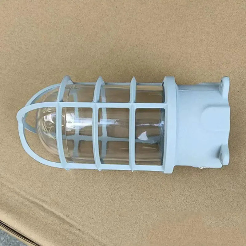 Lampe sécurité industrielle vintage fonte noire bronze bleu clair verre transparent grille métallique