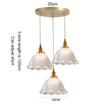 suspension lumineuse vintage vert doré motifs géométriques ampoules câbles chaînes métal