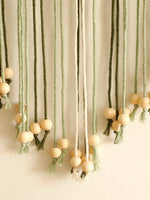 macramé mur vert olive feuilles cœur franges boho décoration murale ornement maison