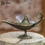 lampe huile bronze ornements floraux artisanale chaîne support traditionnelle métal