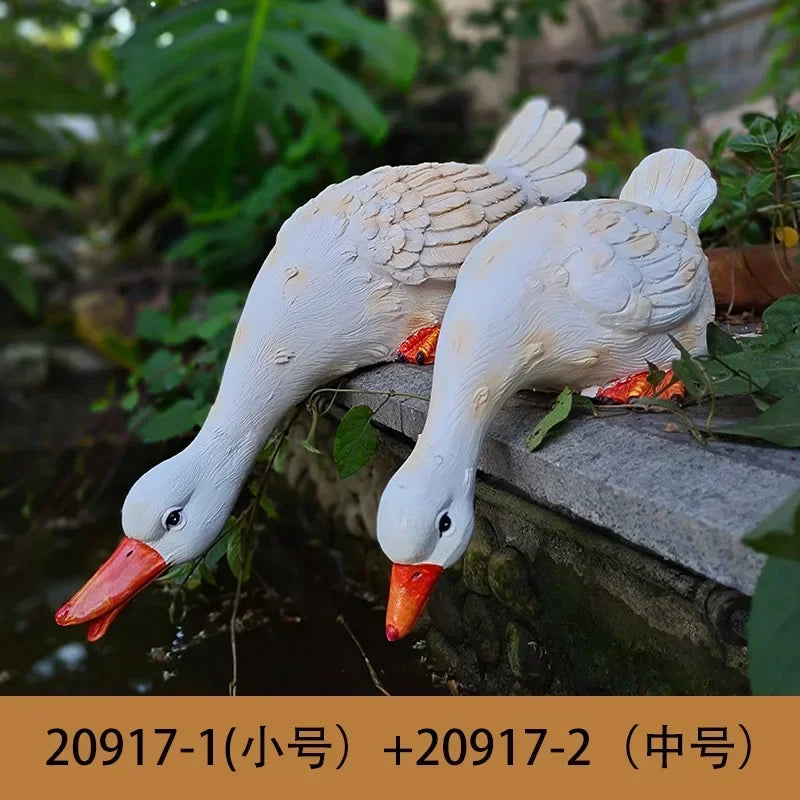 statue canard blanc plumes orange piscine jardin décoration extérieure animaux ornements paysagistes fleurs artificielles