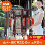 lanterne traditionnelle chinoise bois sculpté rouge décorative pompon fête mariage jardin