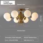 lustre élégant or feuilles stylisées 68cm diamètre 32cm hauteur ampoules e14
