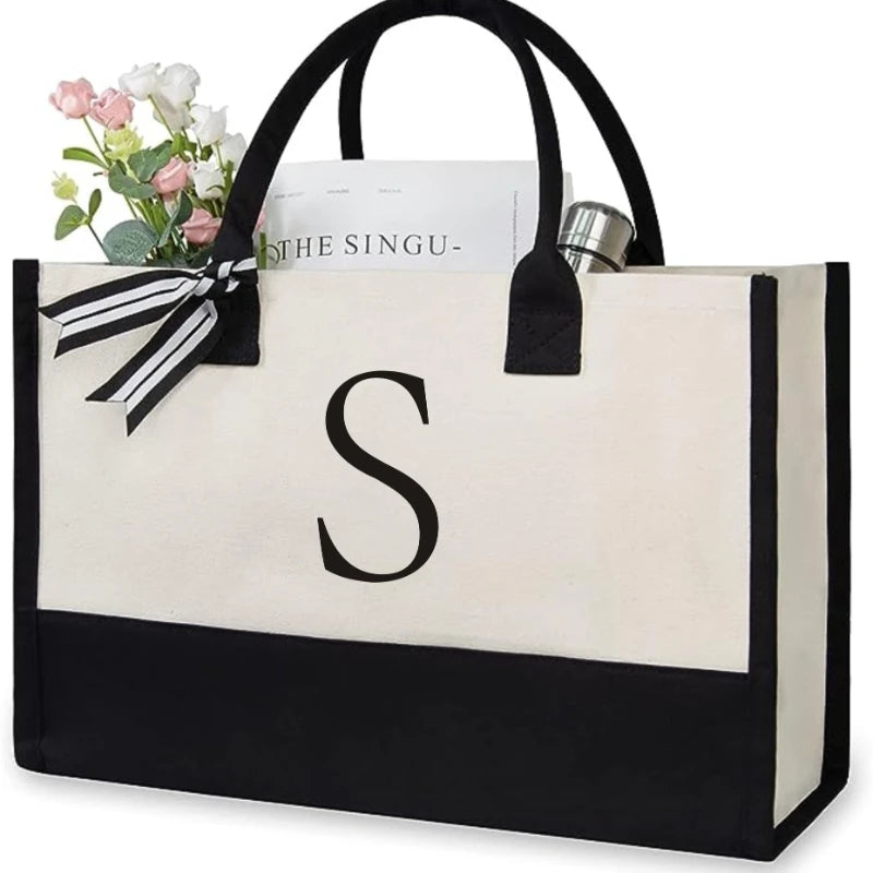 sac main toile lettre imprimée blanc noir rubans classique poignées intérieur noir zippé capacitaire