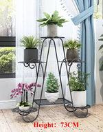 étagère plante métal structure florale courbe élégant pots blancs noirs fixations visuelles