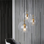 suspension lumineuse moderne transparent doré rayures verticales câble noir ampoules