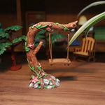 sculpture miniature artisanale arbres feuilles oiseaux balançoire pierres fleurs naturelextérieur jardin decoration résine