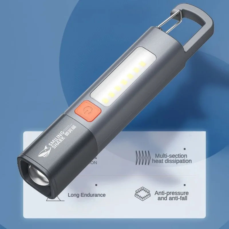 lampe torche rechargeable lumiere intense gris orange moderne anneau fixation interrupteur led