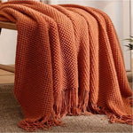 couverture lit orange motif waffle texture bulles confortable moderne canapé salon maison